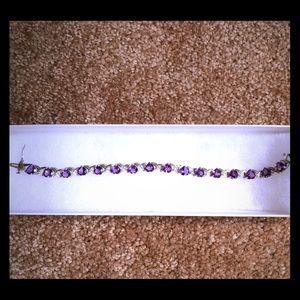 Amethyst and diamond tennis bracelet.