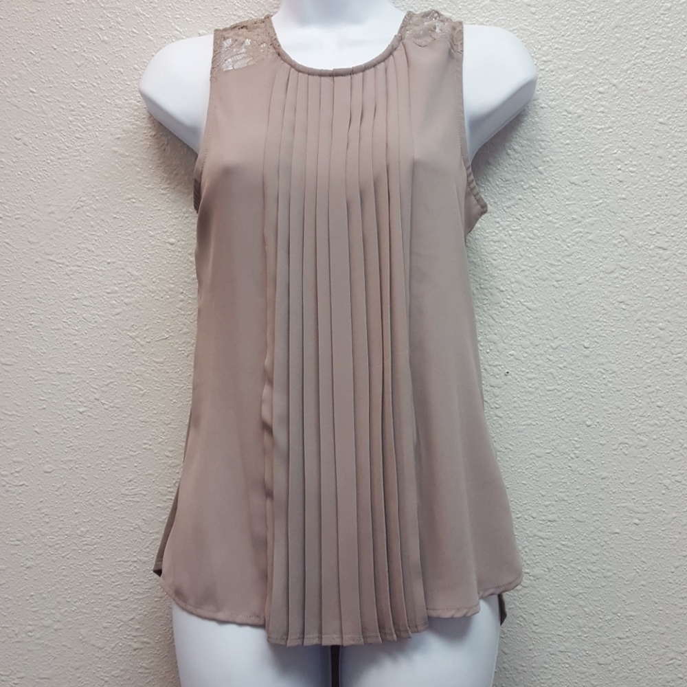 Taupe sleeveless top.