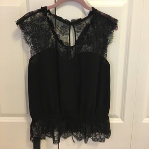 Never worn Express black lace top. Tags attached.