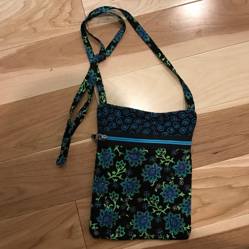 Blue and black flowery shoulder bag.