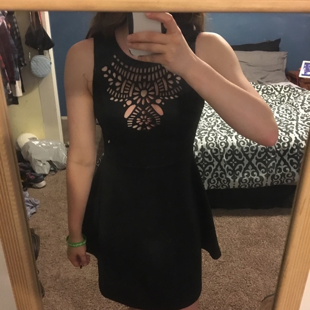 Black dress with cutout details at the neckline