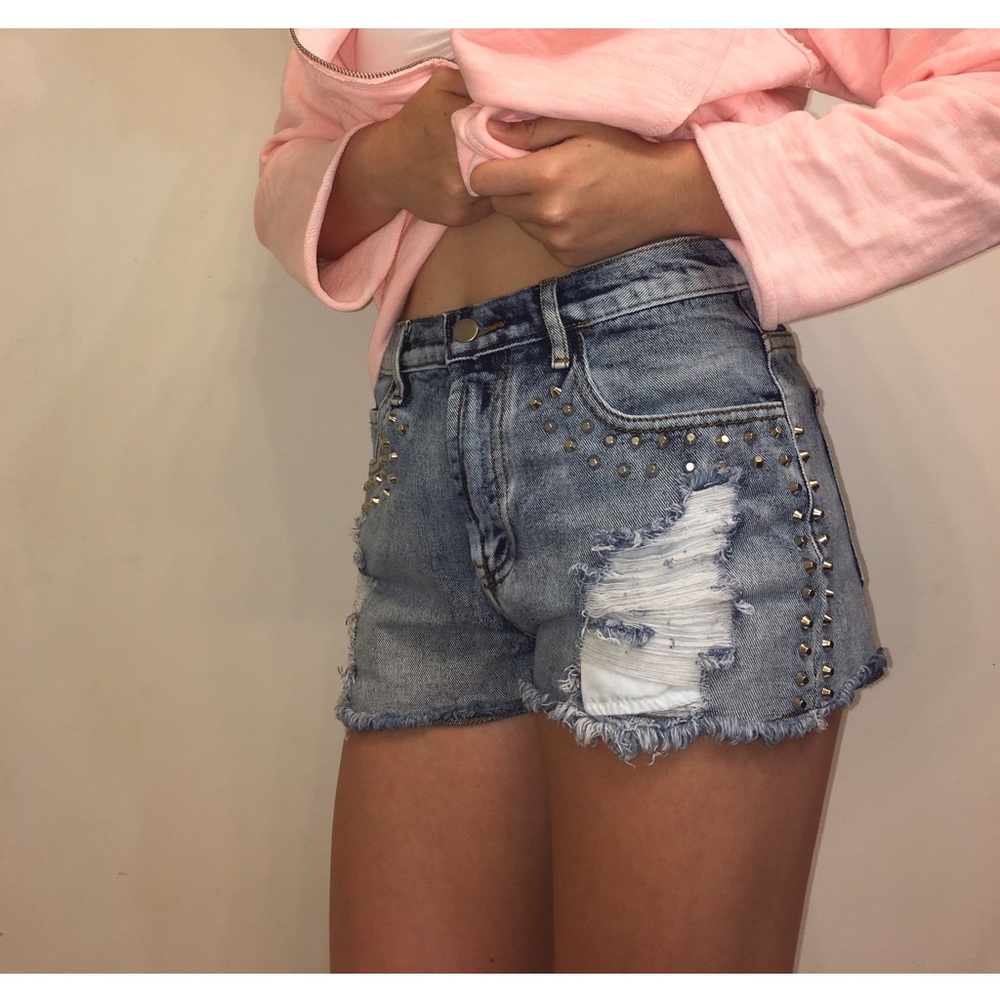 Light blue, ripped, beaded shorts.