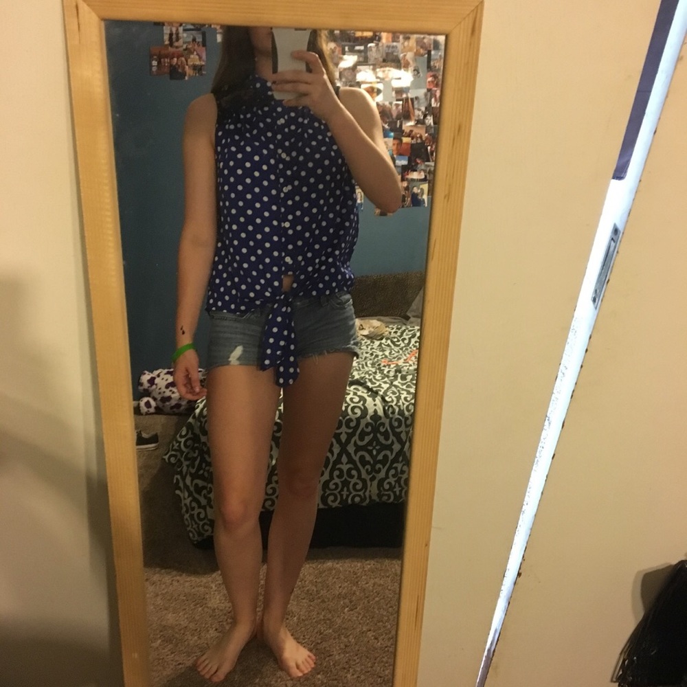 A royal blue and white polka dot button up