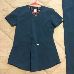 Careisma Brand scrubs. Top and bottoms