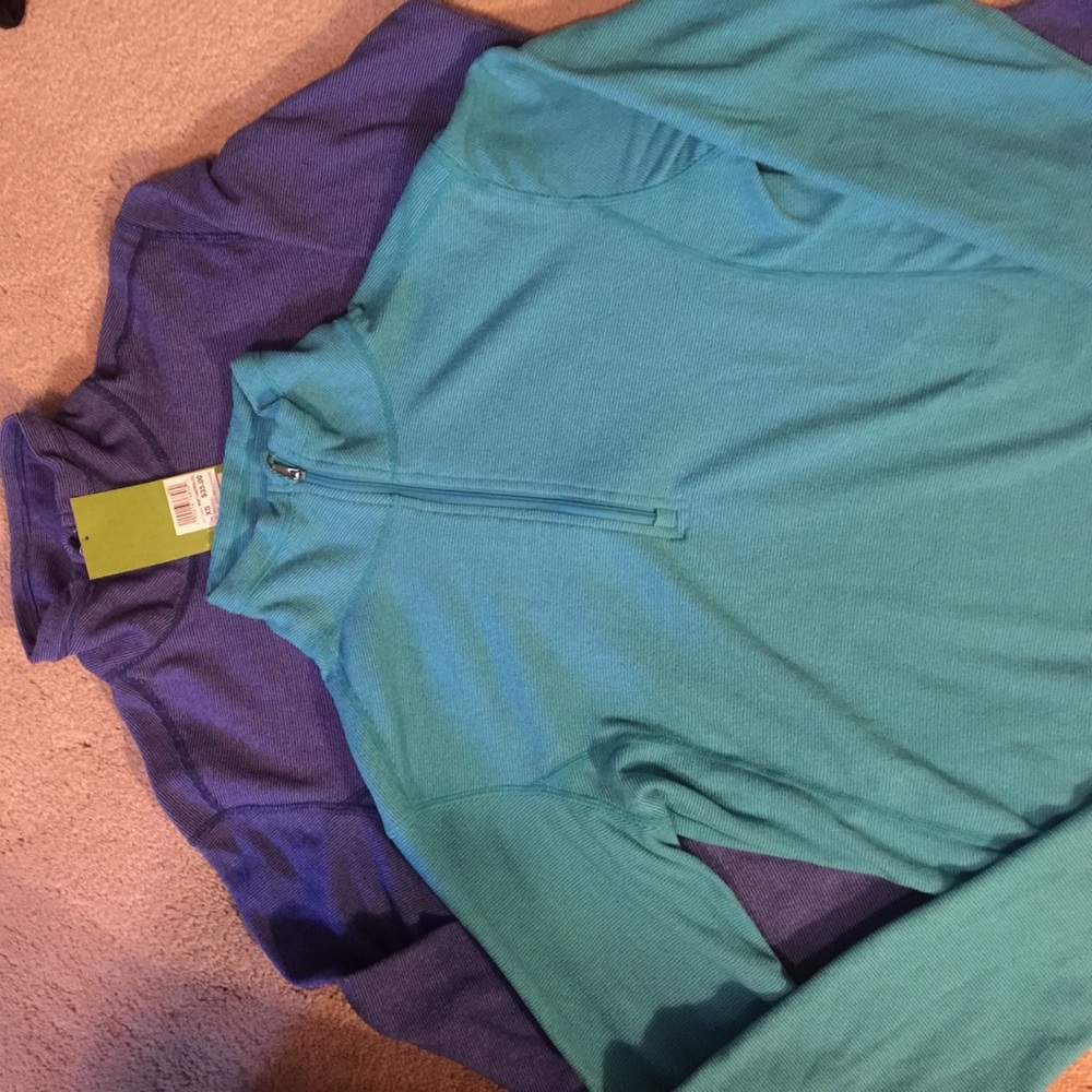 Pair or alpine design pullovers. Both new.