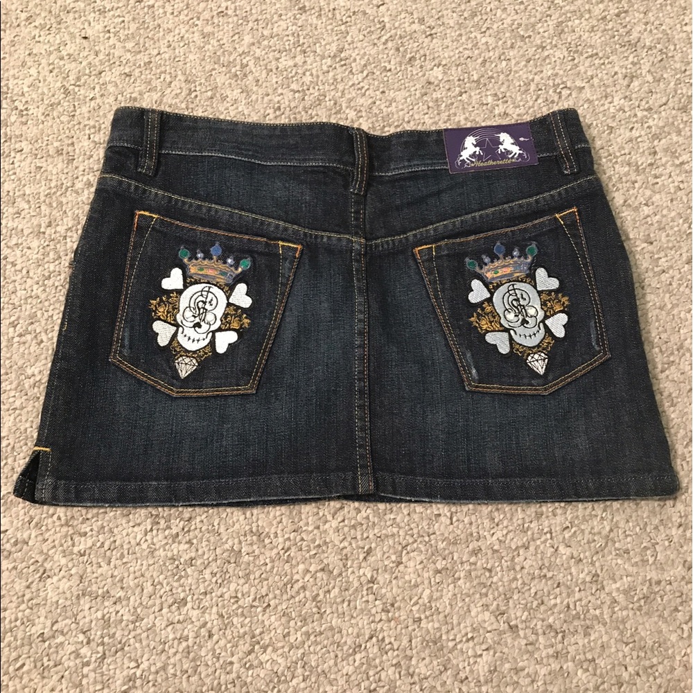 Denim skirt with embroidered pocket details