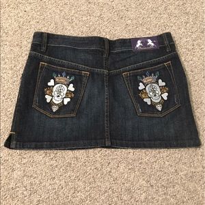 Denim skirt with embroidered pocket details