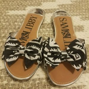Black and white bow slip on sandals. Size 6.