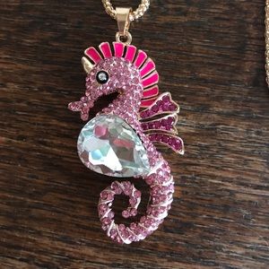 Pink seahorse necklace.