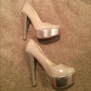 Nude, gold, and taupe platform pumps