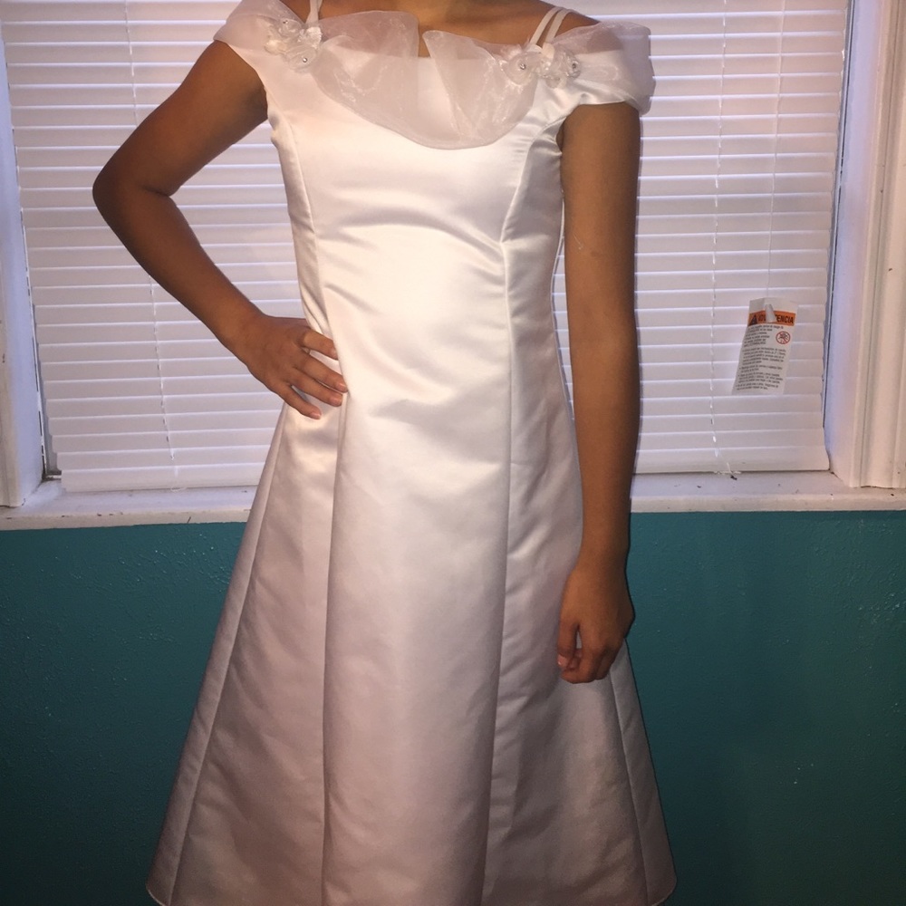 A girls white baptismal dress