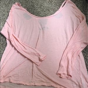 Peachy color shirt with cutouts on back