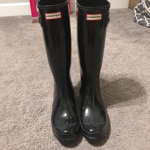 Tall black hunter boots