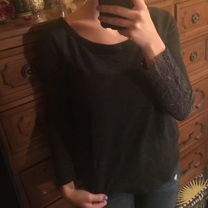 Grey sweater with crocheted wrist detailing