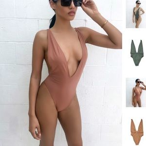 Purple one piece bathing suit. BRAND NEW