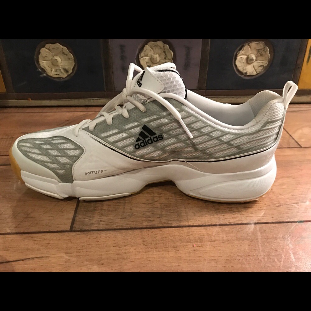 White Adidas athletic shoes