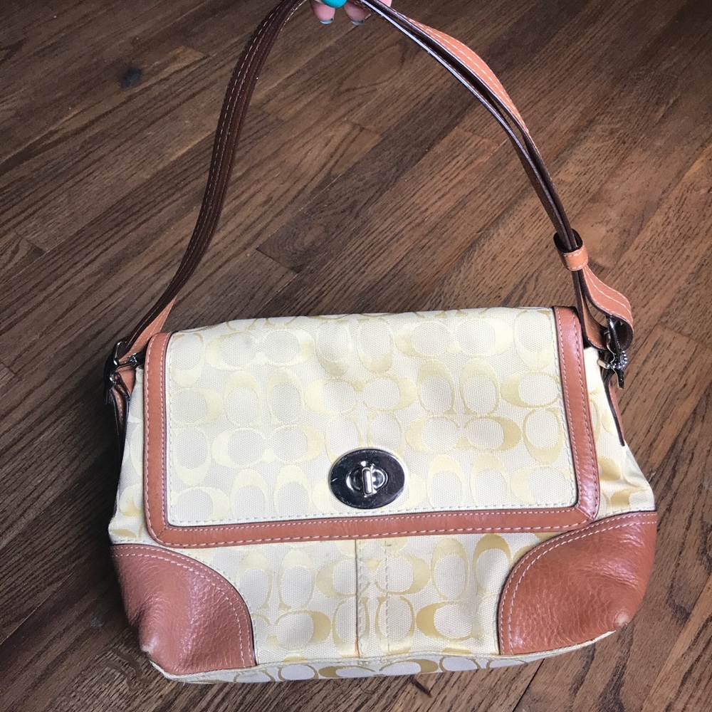 Pale yellow Coach purse