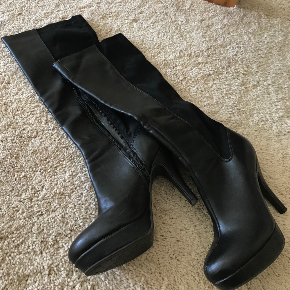 Black tall heeled boots