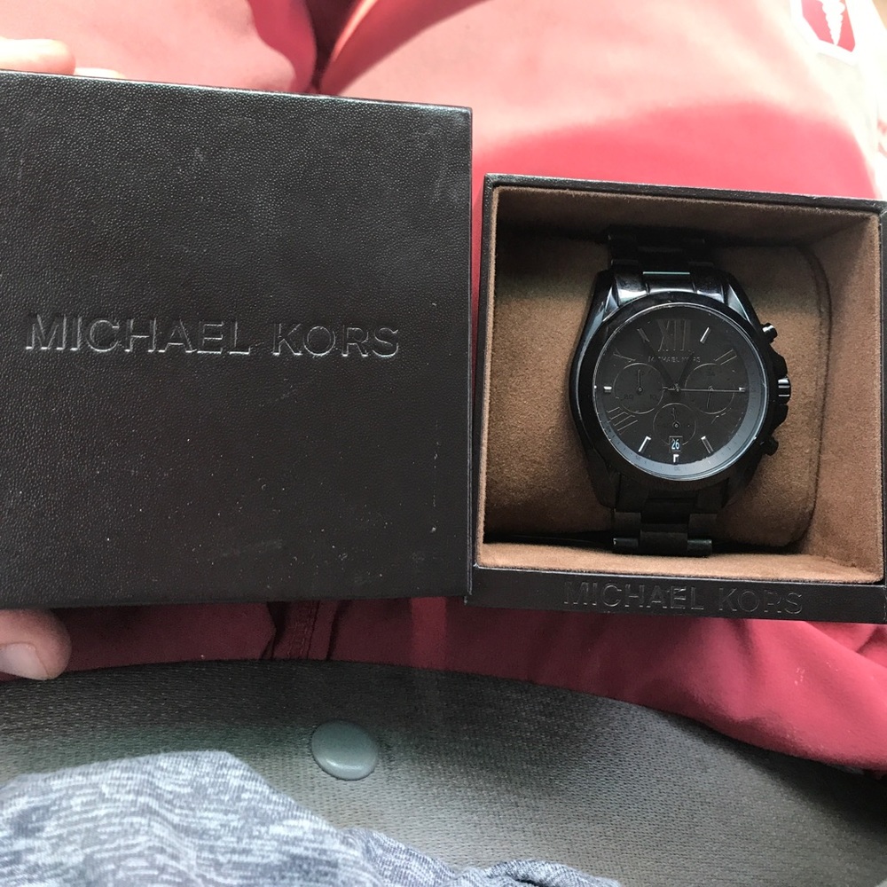 This is a men's MK watch that is all black