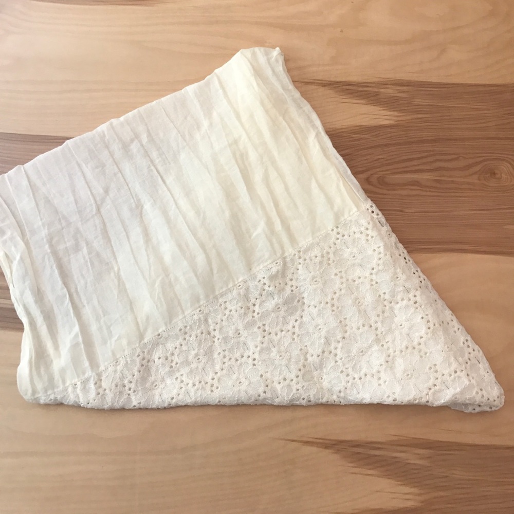 Cream infinity scarf with floral accent