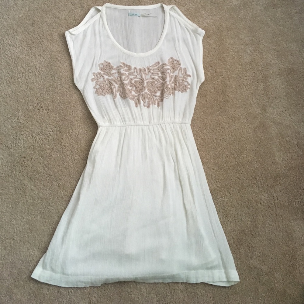 Cream colored dress with tan embroidery