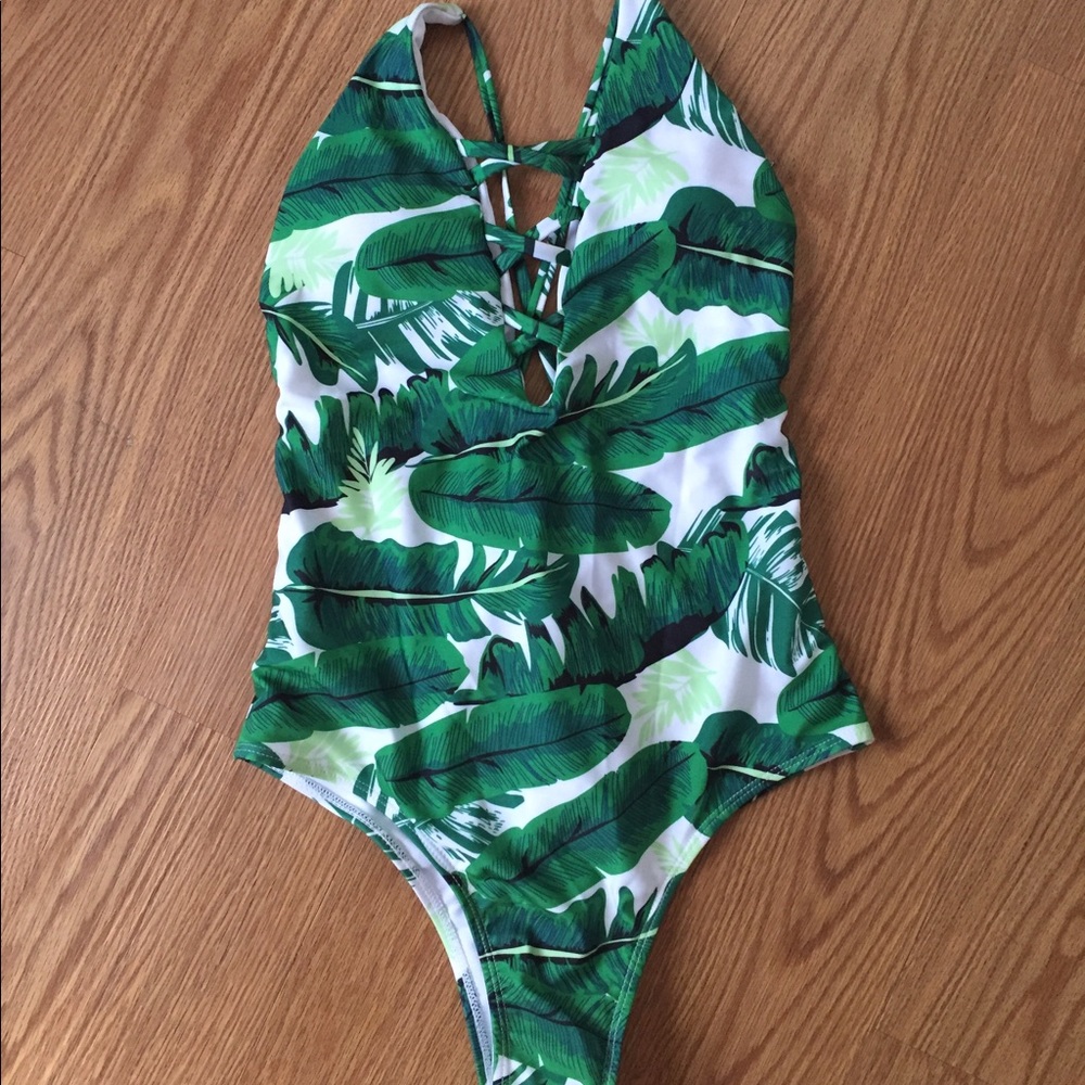 Strappy palm-printed one piece bathing suit