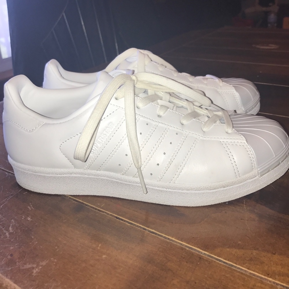 All white adidas superstar sneaker