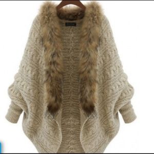 Sweater with fur scarf attached