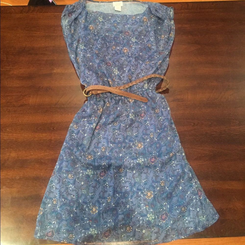 Blue flower printed dress with brown belt.