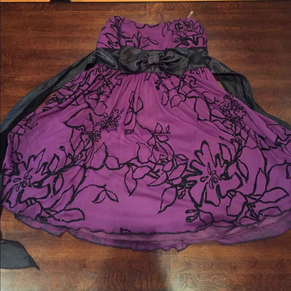 Purple strapless dress.