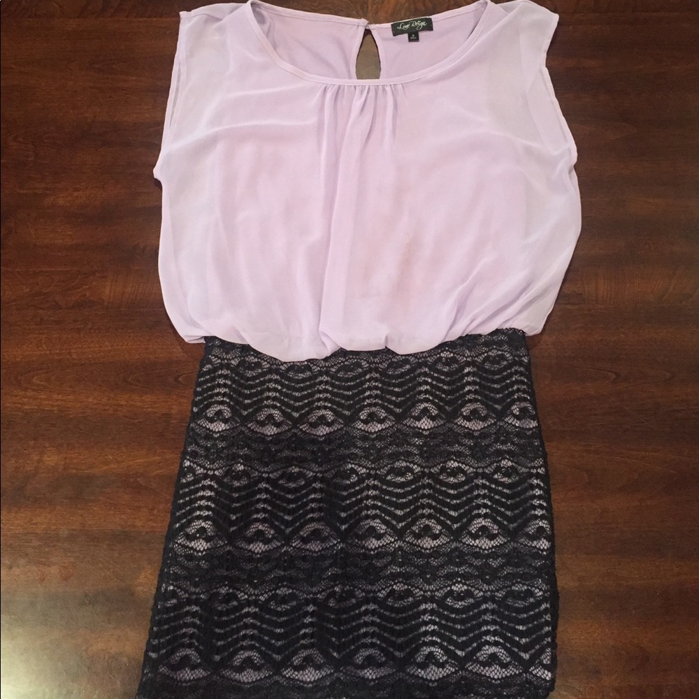 Purple top black bottom tight dress.