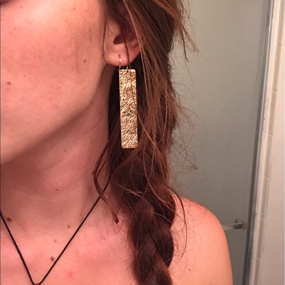 Gold flat rectangle earrings with cool texture