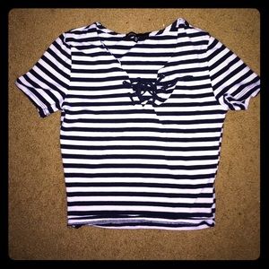Cute striped crop too with cross string chest.