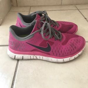 Pink Nike running shoes