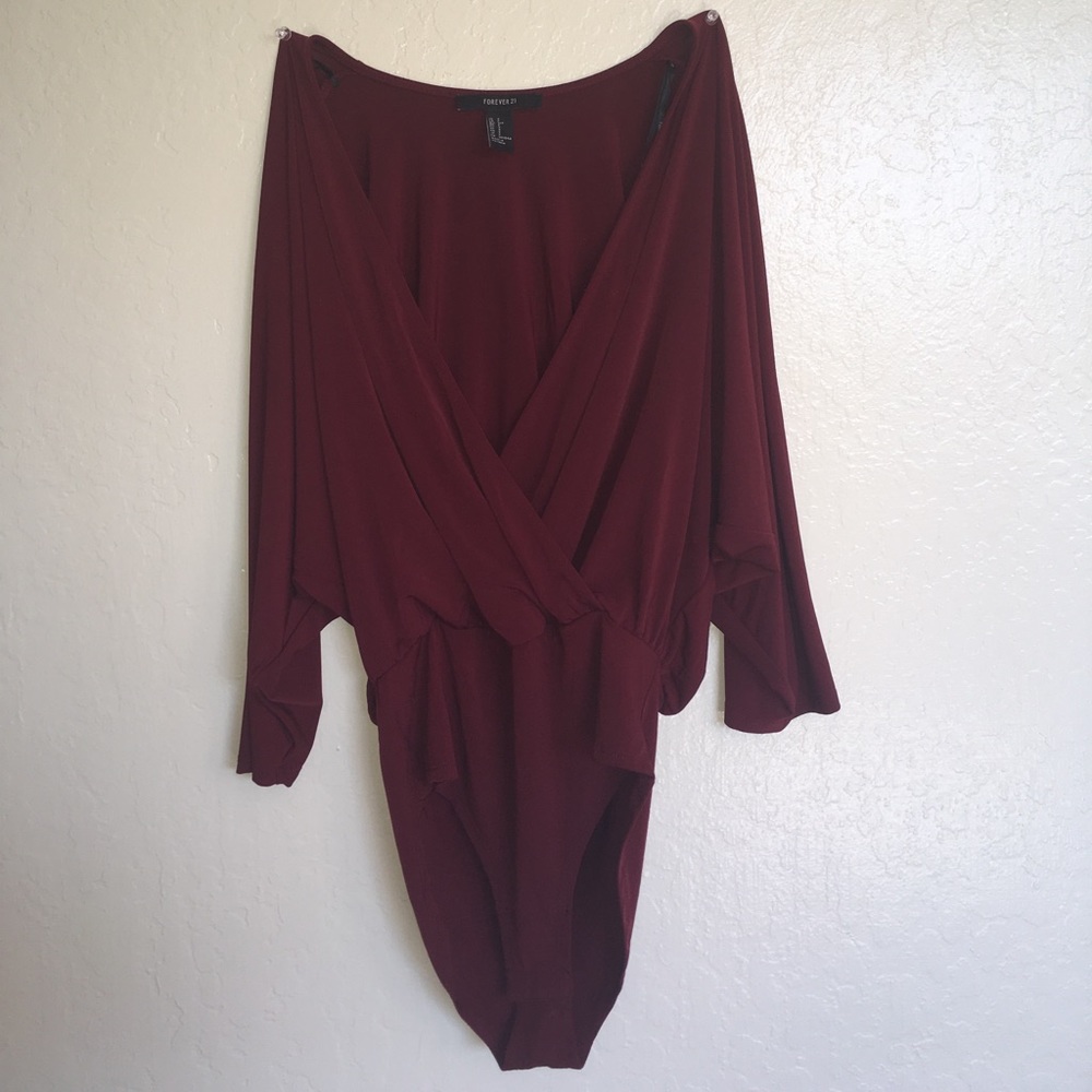 Red 3/4 sleeved body suit.