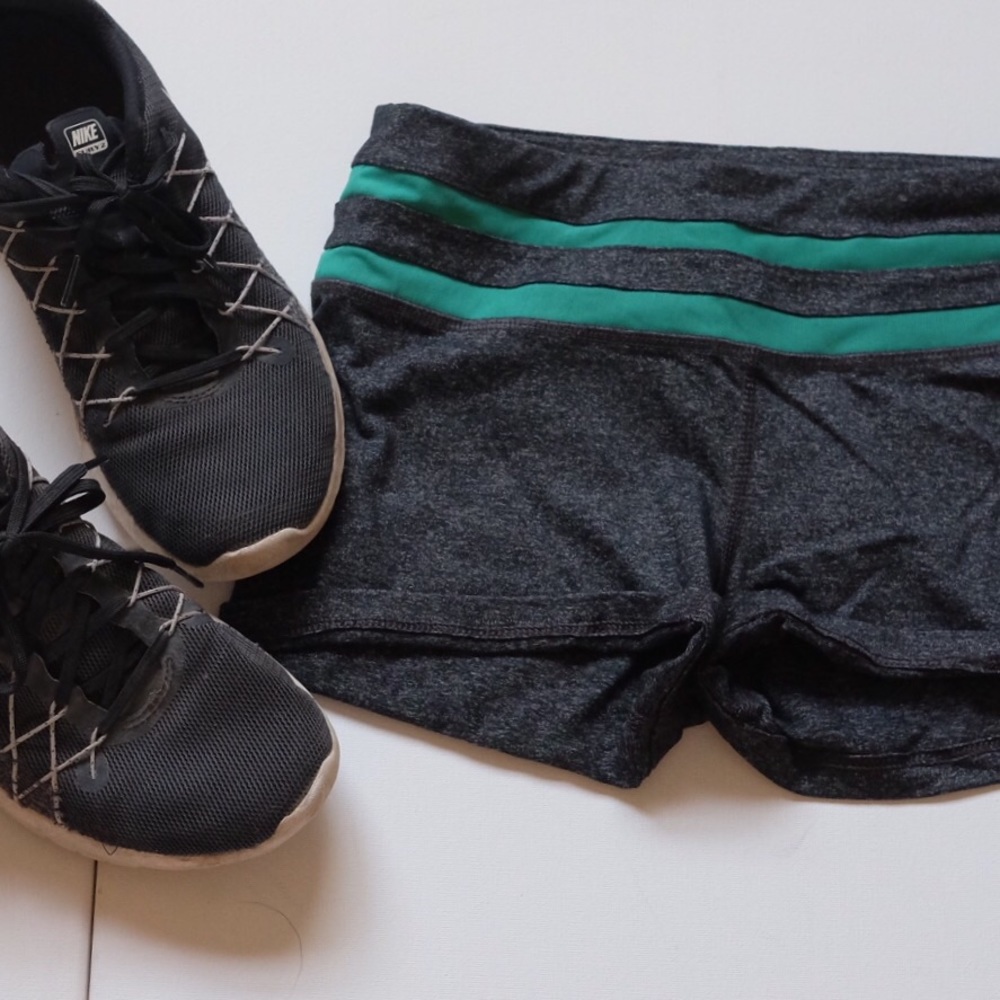 Dark heathered grey shorts with green stripes