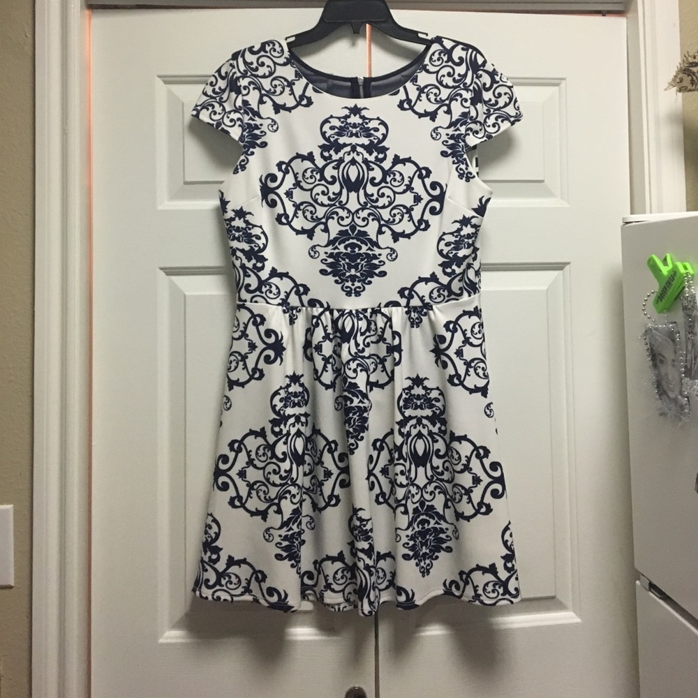 White and Navy Blue Dress with partial mesh back.