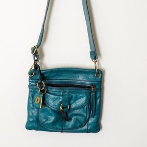Teal fossil cross body bag