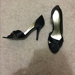 Black satin pumps