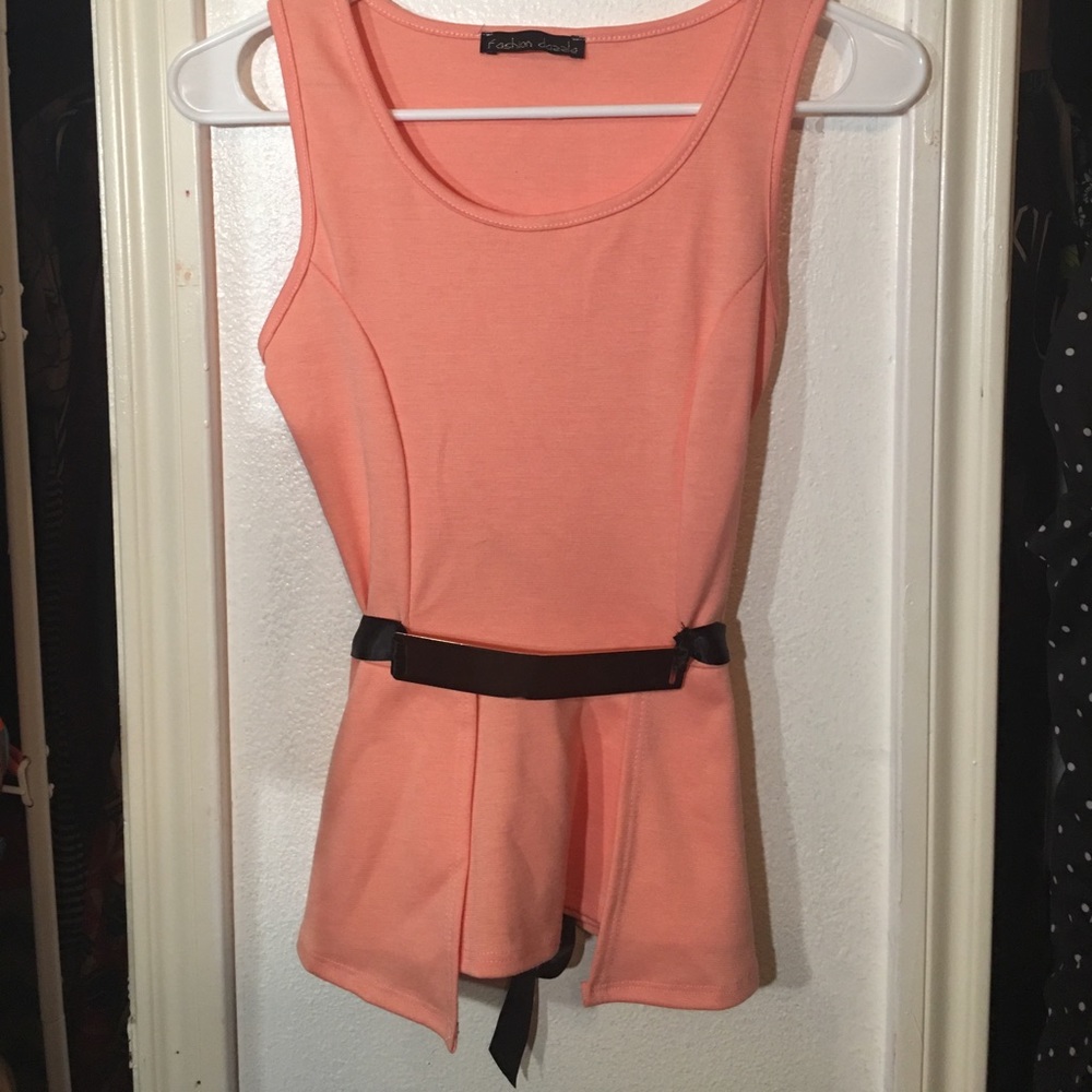 Pink shirt with golden and black belt.