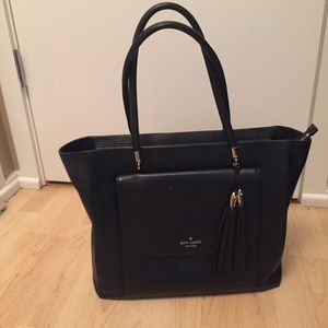 Black Kate Spade handbag with tassels