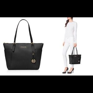 Black leather Michael Kors tote bag.