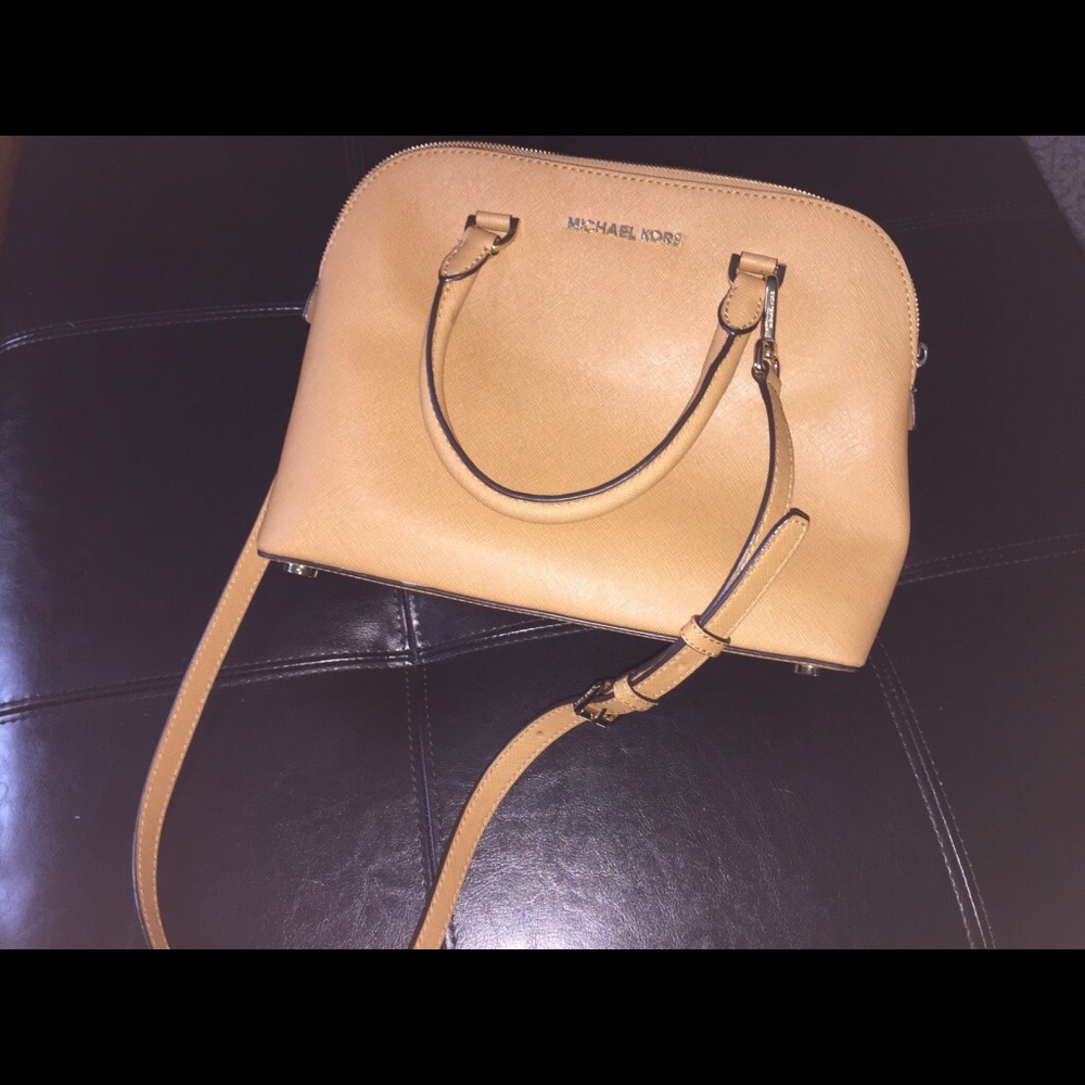 Brown leather Michael Kors sling bag.