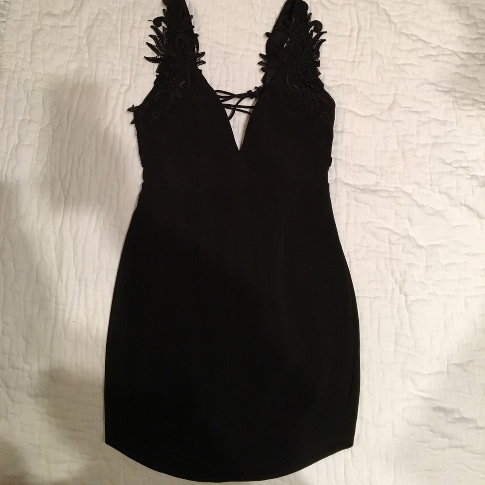 Black cocktail dress with lace-up back