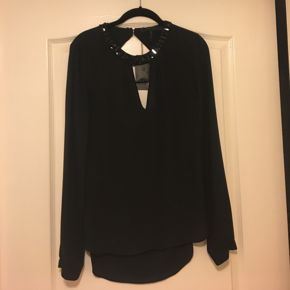 BCBG black long sleeve top with stones on neck