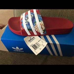 Red adidas slides woman