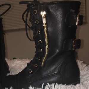 Black leather pair of combat boots