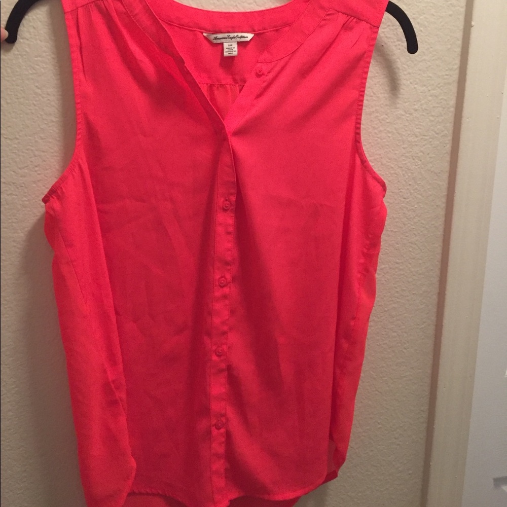 Bright orange/red blouse!