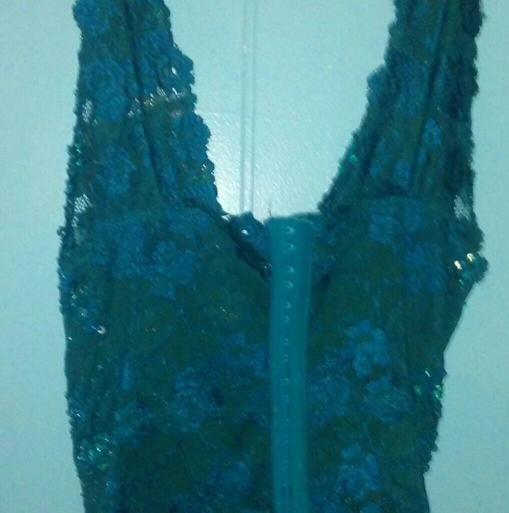 Teal and sequin man catching top