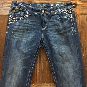 medium wash Miss Me boot cut jeans